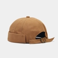 Detailed view of the metal buckle and canvas texture on a vintage brimless docker hat - Adjustable / Plain Khaki