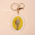 Portachiavi in miniatura con pesce al vapore in resina e anello metallico dorato - Piatto Ovale - Pesce Di Mare / Chiusura Dorata a Forma di 8