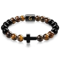 Detail showing tiger eye beads, black cross charm and golden letter G bead on the bracelet - Letter G