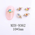Detailed view of aurora heart nail gems with 10x5mm gold setting and small rhinestones - Light of Heaven Golden Style (9362)