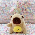 Plush brown capybara keychain with yellow chick detail on colorful foam balls - Holding Chick Light Brown + Gold Clip