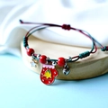 Handmade Christmas woven bracelet with red mitten enamel charm and holiday ornaments - Christmas Mittens