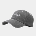 Close-up of washed gray cotton baseball cap featuring white #momlife heart embroidery - Adjustable / Gray