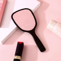 Elegant handheld makeup mirror with black handle and rounded rectangular frame - Black