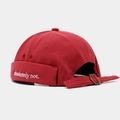 Detail of red canvas docker hat with white absolutely not embroidery and metal buckle - Burgundy