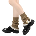 Detail of brown knitted leg warmers with delicate white lace trim and two decorative buttons - One Size / Khaki