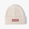 Cream white knitted beanie with New York logo patch and thick ribbed texture design - Adjustable / Off White