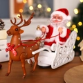 Electric Christmas Santa Claus on a white sleigh with reindeer toy for holiday decoration - Santa Claus on Sleigh with Reindeer