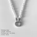 Élégant collier en acier inoxydable avec perles de riz d'eau douce et pendentif argenté - Chaîne Perles de Riz Fermoir Cercle Uni Argent (XNL0002-1)