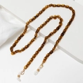 Detail of tortoiseshell acrylic chain with gold lobster clasp and white rubber grips - Tortoise