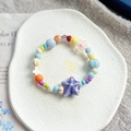 Handmade ceramic bracelet featuring purple starfish and colorful glass beads - Sunday (1048-04)