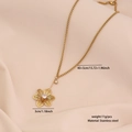 Elegant gold flower pendant necklace in stainless steel on soft beige fabric background - Hollow Zirconia Flower Style (5#)