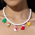 Detailed close-up of beaded Christmas necklace with colorful holiday charms on model - 31358-White Heishi Beaded Christmas Necklace