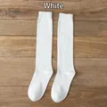 JK uniform white cotton over-knee socks featuring ribbed cuffs on wood background - One Size / White