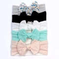 Detail showing 5-piece soft nylon baby headbands with ribbed bows on a display card - Grey+Black+White+Mint Green+Pink (5Pcs Set)