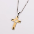 Close-up of dual-tone cross pendant with gold plating and black Greek key patterns - Medium / With Chain / Two-tone (Gold & Silver)
