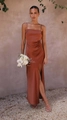 Detail of elegant rust red satin midi dress featuring a stylish side slit and thin straps - S / Tan