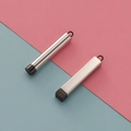 Close-up of cylindrical and rectangular stainless steel pendants with black caps - Cylinder / Black (Inner) + Steel (Outer)