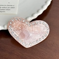 Pink pearl heart hair clip with rhinestone trim on a dark wood background - Hair Clip / Pink