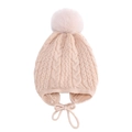 Detailed knit texture of beige baby winter hat featuring earflaps and a fluffy faux fur pom - One Size / Beige