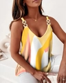 Detail of V-neck sleeveless top featuring golden metal rings and geometric prints - S / Yellow Plaid