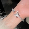 Silver plated open bangle featuring asymmetric cubic zirconia butterflies in polished finish - Silver Butterfly Real Gold Plated