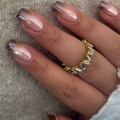 Gold plated ring featuring an irregular baguette cut cubic zirconia staggered design - Yellow Jelly Glue + Nail File