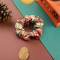 Plaid Christmas scrunchie in red beige and green fabric on a dual color background - Red Beige Green Plaid