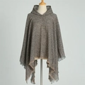 Close-up of brown knit hooded poncho featuring textured fabric and fringe tassel detail - Brown (WT144-11)