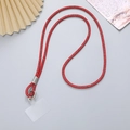 Detail of red rhinestone phone crossbody strap with silver ring buckle and clear pad - Red