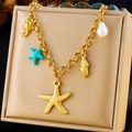 Golden stainless steel ocean theme necklace with starfish, shell, and pearl charms - Turquoise Starfish Shell Fish Style (N3134)