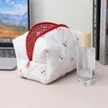 Quilted floral cosmetic bag featuring cherry patterns and a red checkered lining detail - Cherry