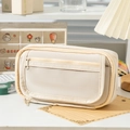 Detail of multi-layer canvas pencil case with transparent window on a desk - Milky White