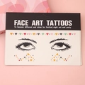 Face Art Tattoos kit with stars and hearts designs in black and gold on pink background - LT10 Eye Heart Combo