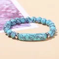Bohemian blue turquoise bead bracelet with central bar stone and dark web patterns - Blue Turquoise