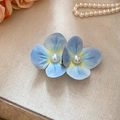 Detail shot of elegant blue floral hair clip with pearl center on linen background - Green Flower / Duckbill Hair Clips