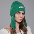Bright green knit beanie with Short Sentence label and decorative button earflaps - Green