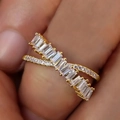Elegant gold-tone criss-cross ring featuring baguette-cut stones and pavé accents for women - US 7 / White Gold