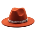Detailed texture of burnt orange wool fedora hat featuring a sparkling rhinestone band - Caramel color