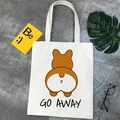 Flat lay of a white canvas tote bag with a cute Corgi print and 'GO AWAY' text - GO AWAY Corgi Butt