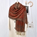Close-up of reddish-brown paisley scarf with tassel trim on beige coat - 13# Orange Red