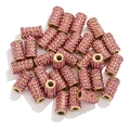 Close-up of sparkling pink rhinestone metal beads for DIY handmade jewelry crafts - Pink