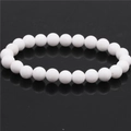 Detail view of 8mm matte white tiger eye agate beads on a minimalist beaded bracelet - Porcelain White