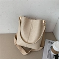 Beige crocodile embossed bucket bag with wide fabric strap and golden metal hardware - Off White