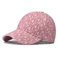 Detailed view of pink houndstooth baseball cap with white L letter and tower pattern - Grid Pink
