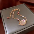 Macro detail of luxury crystal bracelet with pink oval stone and floral inlay on silk - Retro Sweet Rose Quartz Oval Style (43#)