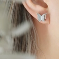 Macro detail of butterfly stud earrings featuring a frosted finish and 3D layered design - Butterfly Stud Earrings / Steel