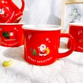 Red Christmas ceramic mug with Santa Claus and Merry Christmas print on lace background - D Carrying Gifts