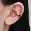 Gothic gold triple skull ear cuff for women, retro Halloween punk clip-on earring style - Antique Gold (A-990)
