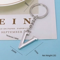 Polished silver metal letter V keychain with flat ring, weighs 12g and is 3.8mm thick - Letter-V